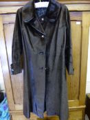 A Lady's Vintage Seal Coat, size Small approx length 102 cms, the coat having leather button holes