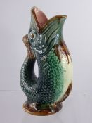 A Pair of Majolica Glug Jugs, with blue green glaze and pink interiors, approx 25 cms