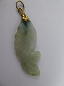 An Antique Chinese White and Green Jade Hand Carved Pendant, depicting a fish, approx 4.5 cms with