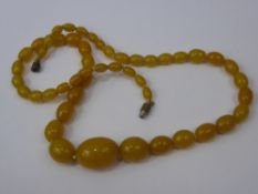 A Lady's Antique Amber Coloured Necklace, approx 23 x 18 mm, approx 28 cms.