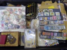 A Large Suitcase and a Carrier Bag Containing a Variety of All-world Stamps, in albums, packets