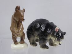 A Pair of Japanese Porcelain Black Bear Figurines, together with a Russian made brown bear figurine.
