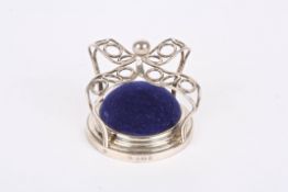 An Edwardian novelty silver crown shaped pin cushionhallmarked Birmingham 1904, with blue velvet