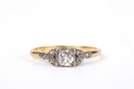 An 18ct gold, platinum and diamond solitaire ringset with central diamond weighing approx. 0.25cts,