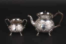 A Victorian two piece tea set, hallmarked London 1898, comprising a teapot and sugar bowl, with