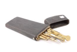 A 19th century black fishskin-covered pocket set of drawing instrumentsthe tapered case with lid