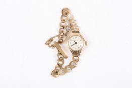 A 9ct gold Carronade ladies wrist watchthe silvered dial with black Arabic numerals, 17 jewel
