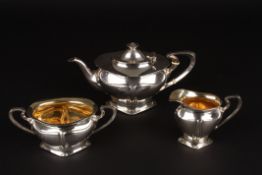 An Edwardian Art Nouveau silver three piece tea sethallmarked Birmingham 1903, naturalistic form