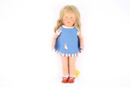 A Kathe Kruse composite headed dollGerman, with 1960s dress and original label., 48 cm high.