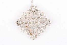 An Edwardian gold and diamond foliate broochset with central diamond weighing approximately 0.