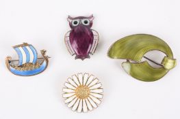 A George Jensen silver gilt and white enamel daisy brooch, a silver and purple enamel owl brooch