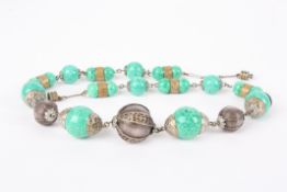 An unusual white metal and ceramic bead necklacethe central white metal bead with filigree