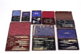 Eight boxes of varying sizes containing drawing instrumentslate 19th and 20th centuryincluding a