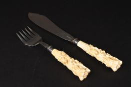 A pair of George V silver and carved ivory fish servers by Walker & Hallhallmarked Sheffield