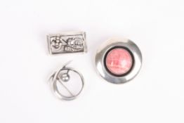 Three Sterling silver Scandinavian broochesthe first of circular form inset with hard stone