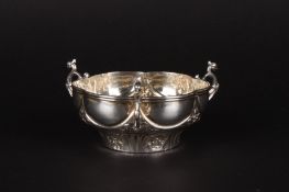 A Victorian three handled bonbon dishhallmarked London 1890, of lobed form and embossed with