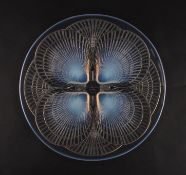 A Lalique Coquilles opalescent glass dishdecorated with four scallop shaped shells, with wheel