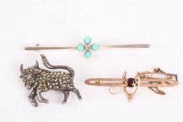 An Edwardian turquoise and diamond set brooch of quatrefoil design with central diamond, a 9ct