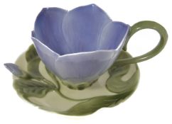 A Franz porcelain cabinet cup and saucer in the form of a flower, signed to the base. Condition: