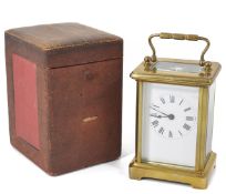 An early 20th century French brass carriage clock timepiece the white enamel dial with black Roman