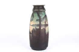A large Muller Freres cameo glass vase with acid etched decoration of trees against a scenic lake