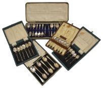A collection of four cased sets of silver spoons comprising two sets of apostle spoons, a set of
