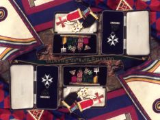 A collection of early 20th Century and later Masonic regalia including aprons, sashes and a