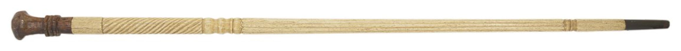 A late 19th century whalebone walking stick with octagonal shaped pommel and part twisted shaft