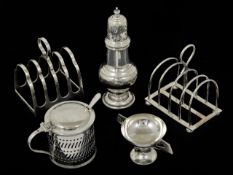 A silver mustard pot with blue glass liner together with a silver baluster pepperette, a silver