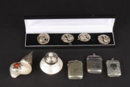 A collection of objets d'art including a silver and two silver plated vestas, two white metal