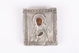 A small Russian .84 silver icon of a saint hallmarked and initialled BC and dated 1865. 5.25 x 4.