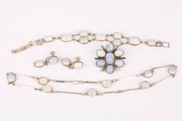 A sterling silver mounted modernist design dress bracelet, set with large 'moonstone' glass
