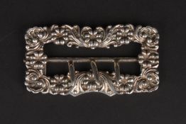 A Victorian silver belt buckle hallmarked Chester 1898, decorated with flowers. Makers mark: