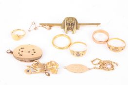 A delicate 9ct gold 'love' brooch in the form of a woman's hand holding a sapphire set heart sold