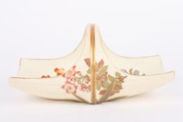 A Royal Worcester ivory ground basket, decorated with flowers, puce mark and numbered 1254 to the