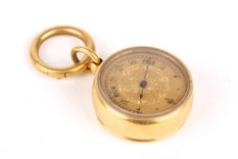 A Victorian yellow metal miniature fob barometer the gilded dial with engraved decoration, black