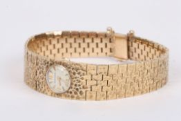 A Jaeger le Coultre 9ct gold ladies wrist watch the small circular silvered dial with gilt Arabic