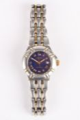 A ladies Krieger quartz wrist watch the blue dial with gilt Roman numerals and date aperture, on a