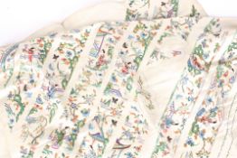 A late 19th/early 20th century uncut Chinese silk embroidered robe appliqué panel, the cream silk