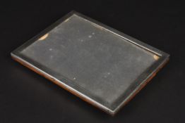 A George V engine turned silver photograph frame with oak easel back frame, makers mark: Sanders &