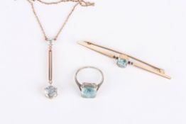 A 9ct gold and aquamarine drop pendant necklace and chain together with an aquamarine brooch and a