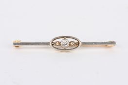 A gold, platinum and diamond bar brooch set with diamond weighing approx. 0.14cts, in unmarked