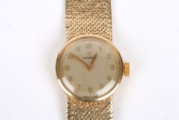 A ladies Omega 9ct gold wrist watch the circular silvered dial signed Omega and with Arabic