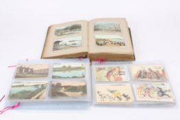 A large collection of assorted early 20th century postcards with subjects including landscapes,