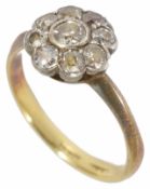 A late Edwardian circular diamond set cluster ring, 18ct gold and platinum mount size LCondition: