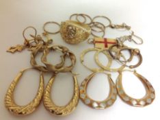 A Contemporary silver gilt dress ring of pierced floral design, together with a collection of 9ct