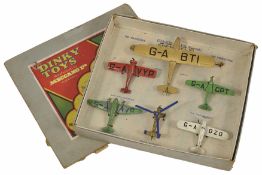 Set of six Dinky aeroplanes in original box numbered 60. One large gold aeroplane, Imperial