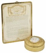 A gilt metal trinket box 20th century, the circular box with hinged cover, the cover with an oval