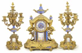 A French gilt clock garniture the clock with circular dial with Roman numerals, mounted with an