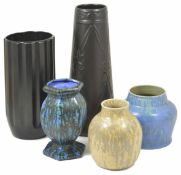A Ruskin cream glazed vase dated 1927 together with a Belgian urn shaped vase, a tall black Athens